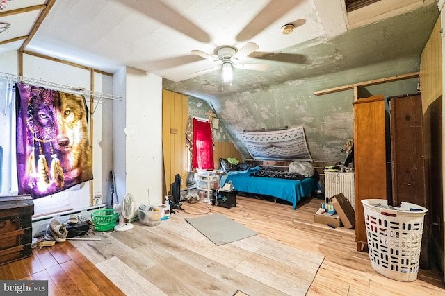 bedroom featuring lofted ceiling, hardwood / wood-style floors, and ceiling fan