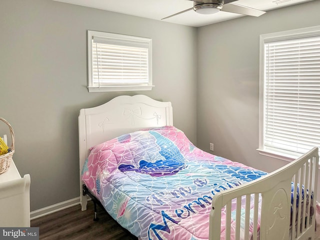 bedroom featuring dark wood-type flooring and ceiling fan