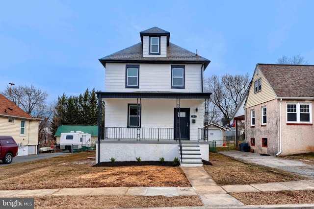 view of front of house with covered porch and a garage