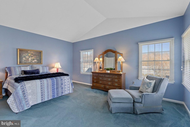 carpeted bedroom featuring lofted ceiling and baseboards