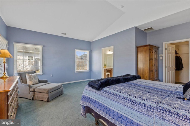 carpeted bedroom with lofted ceiling, baseboards, visible vents, and ensuite bathroom