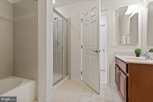 full bath with vanity, a bath, a shower stall, and tile patterned flooring