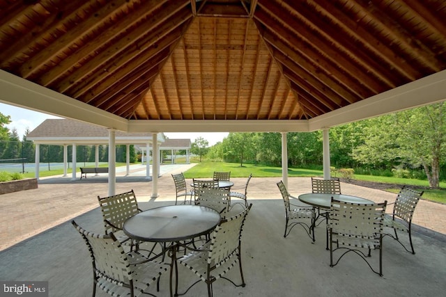 view of patio with a gazebo and outdoor dining area