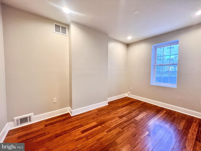 unfurnished room featuring hardwood / wood-style floors