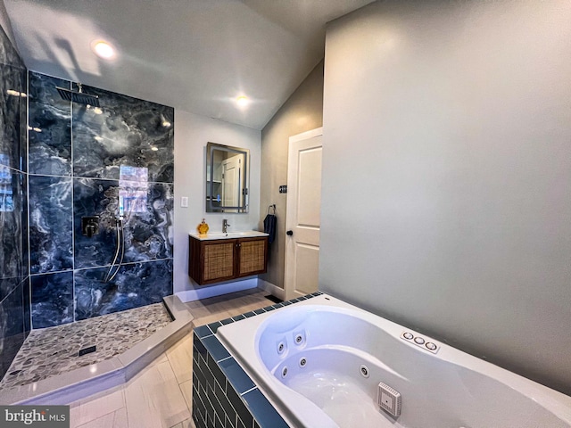 bathroom with vaulted ceiling, independent shower and bath, and vanity