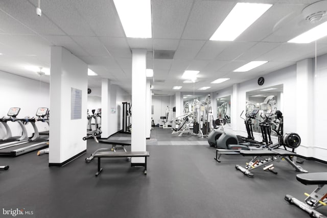 exercise room with a drop ceiling