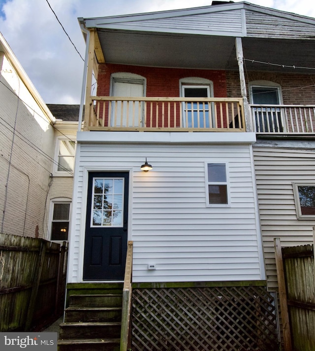 doorway to property featuring a balcony