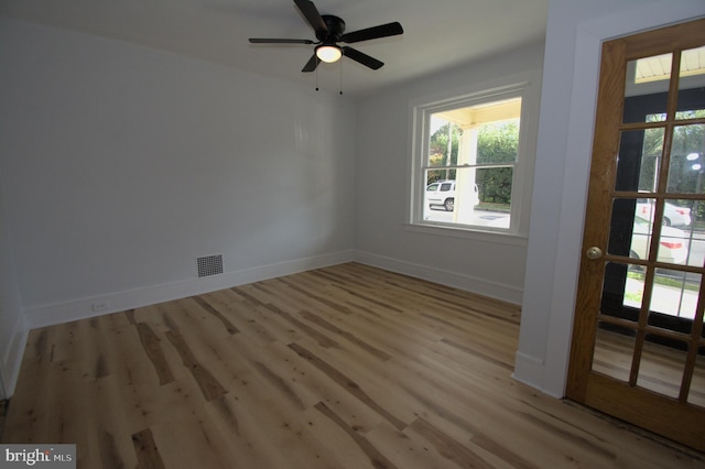 unfurnished room with ceiling fan and light hardwood / wood-style floors