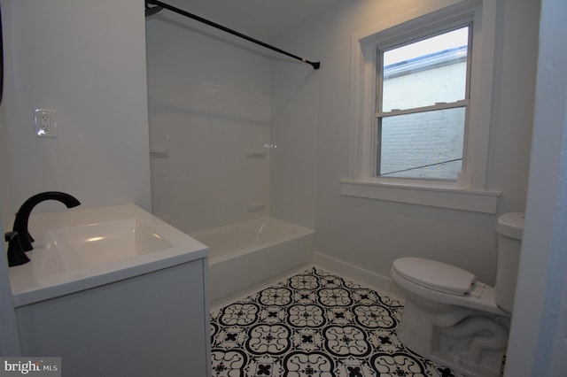 full bathroom with tile patterned floors, toilet, vanity, and shower / washtub combination