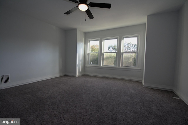 carpeted empty room featuring ceiling fan