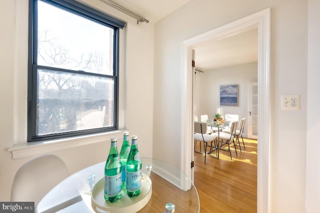 dining area featuring wood finished floors and baseboards