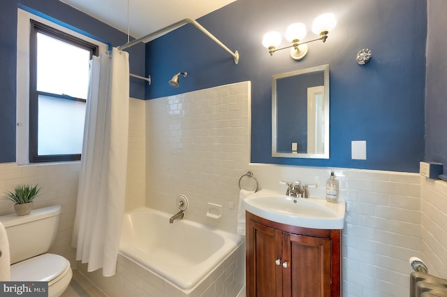 bathroom featuring toilet, plenty of natural light, radiator, and tile walls