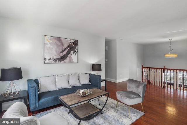 living room with dark hardwood / wood-style flooring