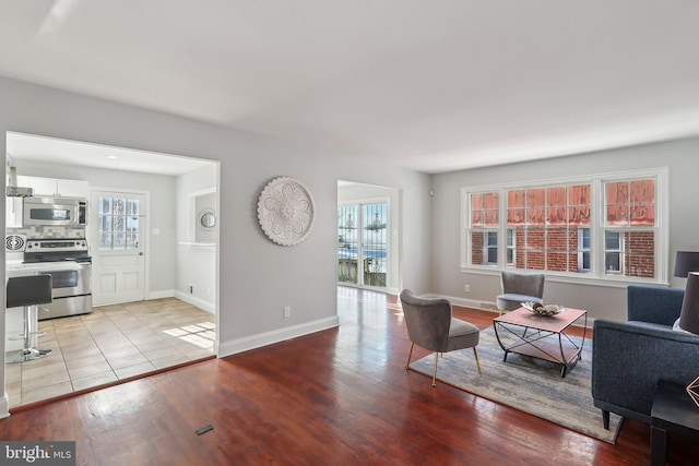 living room with light hardwood / wood-style flooring