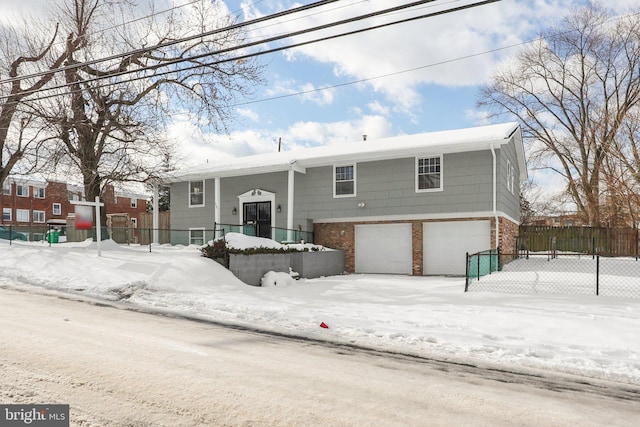 split foyer home featuring a garage