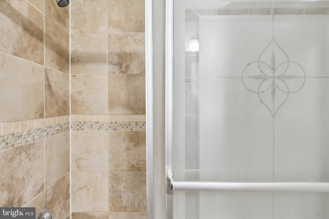 bathroom with a tile shower