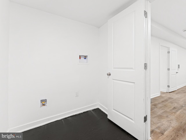 laundry area with hookup for a washing machine, laundry area, baseboards, and dark wood-style floors