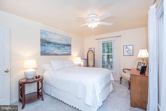 bedroom featuring ceiling fan and light colored carpet