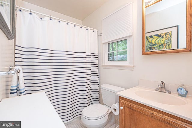 bathroom featuring toilet and vanity