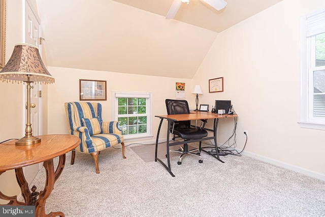 carpeted office space featuring lofted ceiling and ceiling fan