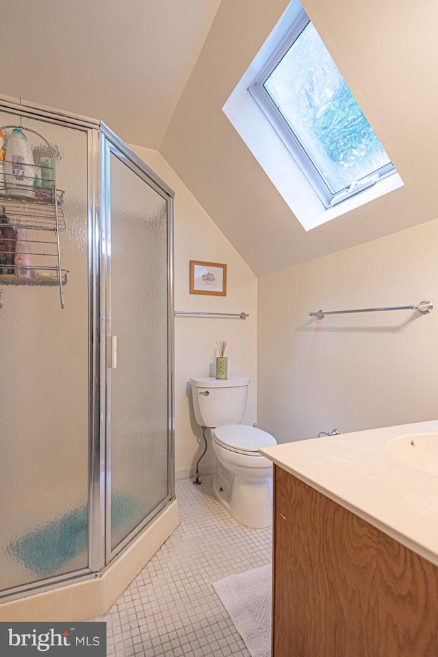 bathroom with tile patterned flooring, vanity, an enclosed shower, and toilet