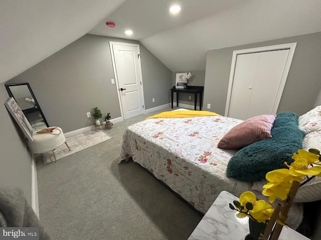 carpeted bedroom with vaulted ceiling