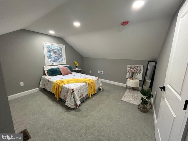 bedroom featuring vaulted ceiling and carpet floors