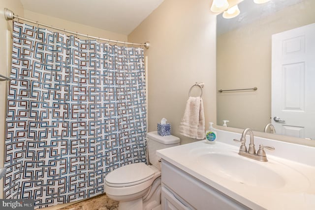 bathroom with a shower with shower curtain, vanity, and toilet