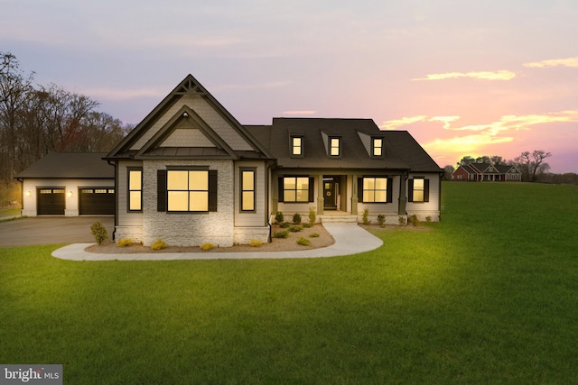 view of front facade featuring a yard and a garage