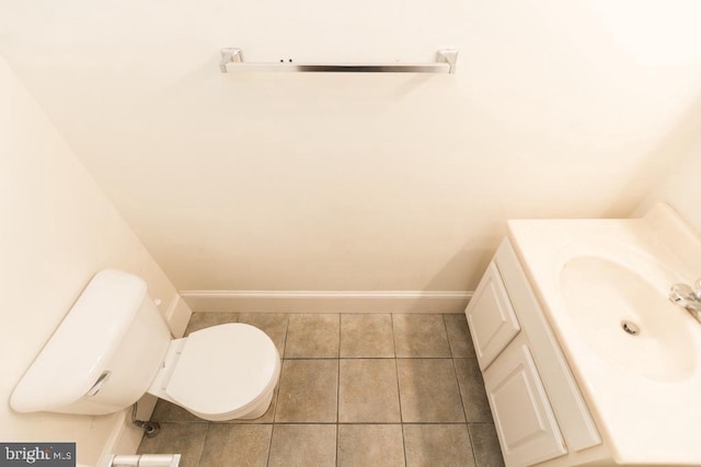 bathroom featuring vanity, toilet, and tile patterned flooring