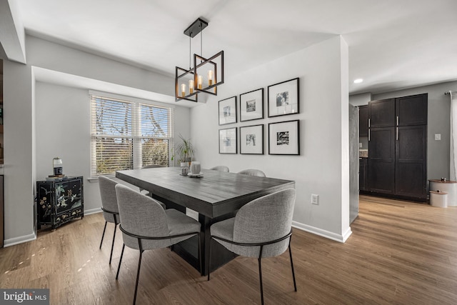 dining space featuring light wood finished floors, recessed lighting, and baseboards