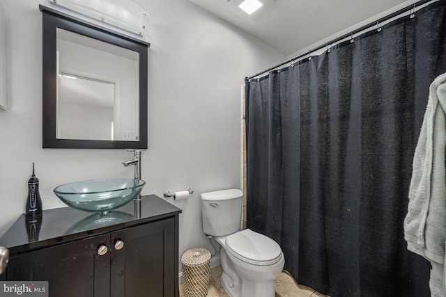 full bath featuring toilet and vanity