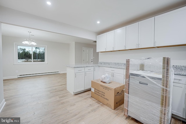 kitchen with light stone countertops, baseboard heating, decorative light fixtures, light hardwood / wood-style floors, and white cabinetry