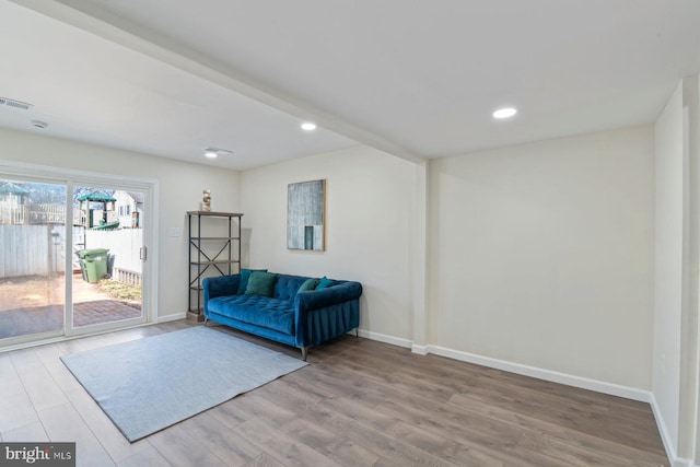 unfurnished room featuring recessed lighting, visible vents, baseboards, and wood finished floors