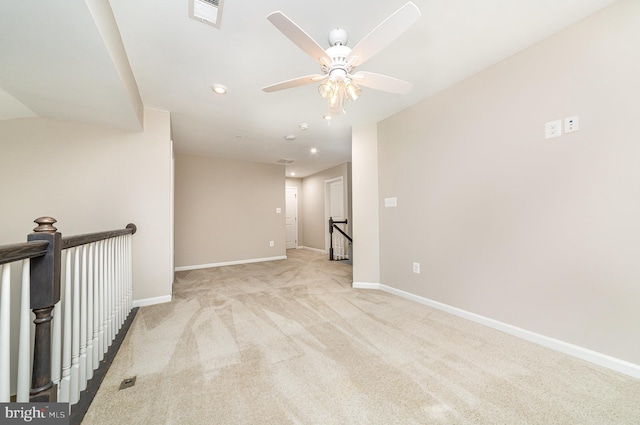 carpeted empty room with recessed lighting, visible vents, ceiling fan, and baseboards