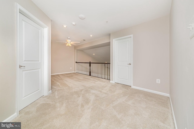 carpeted empty room featuring lofted ceiling, ceiling fan, baseboards, and recessed lighting