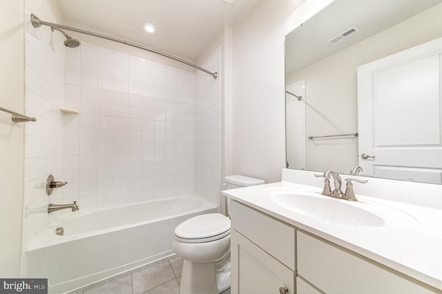 bathroom featuring visible vents, toilet, tile patterned flooring, vanity, and shower / bathing tub combination