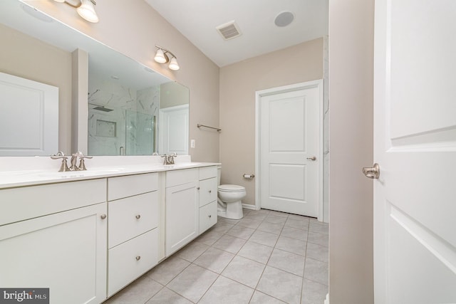 bathroom featuring a marble finish shower, double vanity, visible vents, a sink, and tile patterned floors