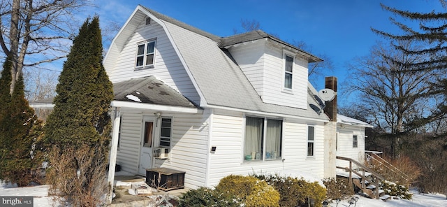 view of front of property with central air condition unit