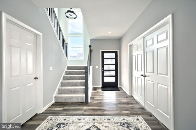 entryway with dark wood-type flooring