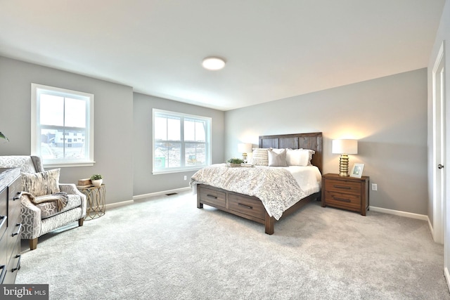 bedroom featuring light carpet