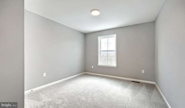 unfurnished room featuring carpet floors