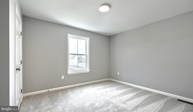 unfurnished room featuring carpet flooring