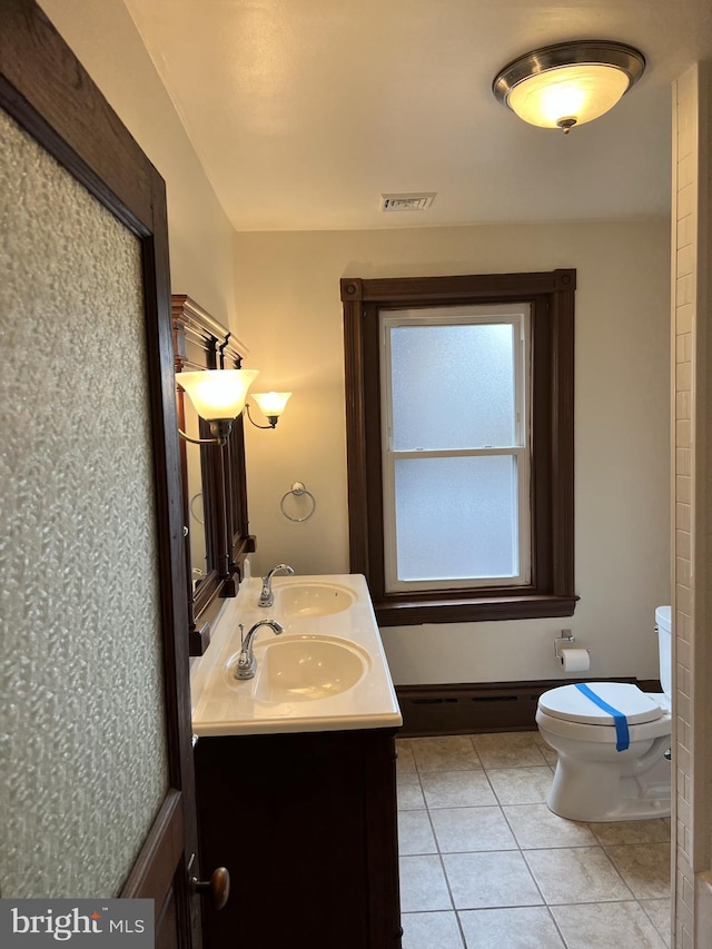 full bathroom with visible vents, tile patterned flooring, a sink, and toilet