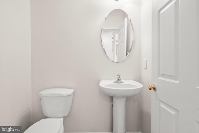 bathroom with sink and toilet