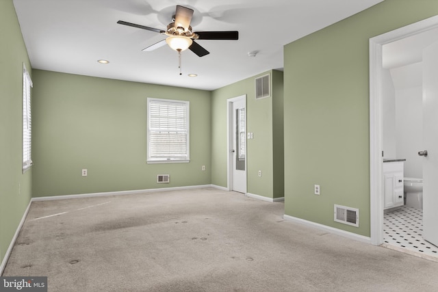 unfurnished bedroom with light carpet and visible vents