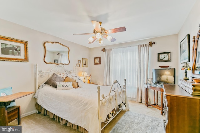 bedroom featuring light carpet