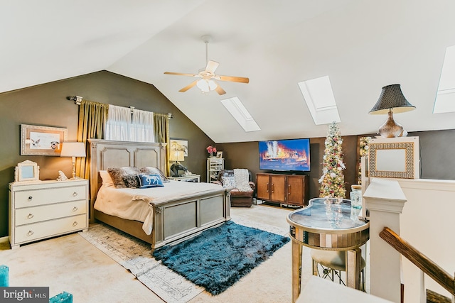 carpeted bedroom with vaulted ceiling with skylight