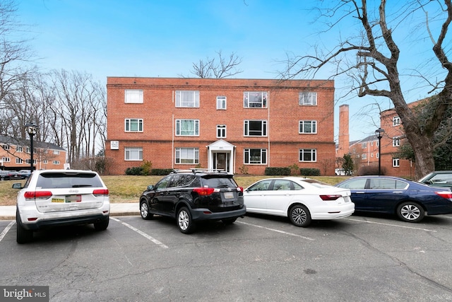 view of property with uncovered parking