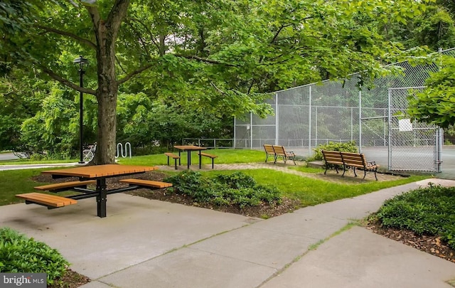 view of home's community with fence